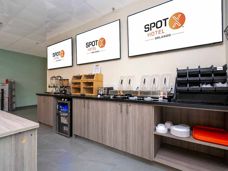 Hotel breakfast area in Orlando with dishes and food on display