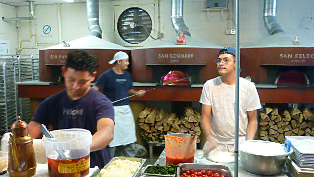 Where to eat in Altanta: Pizza chefs prepare pizzas at Pizzeria Antico |  Photo: This World is Ours