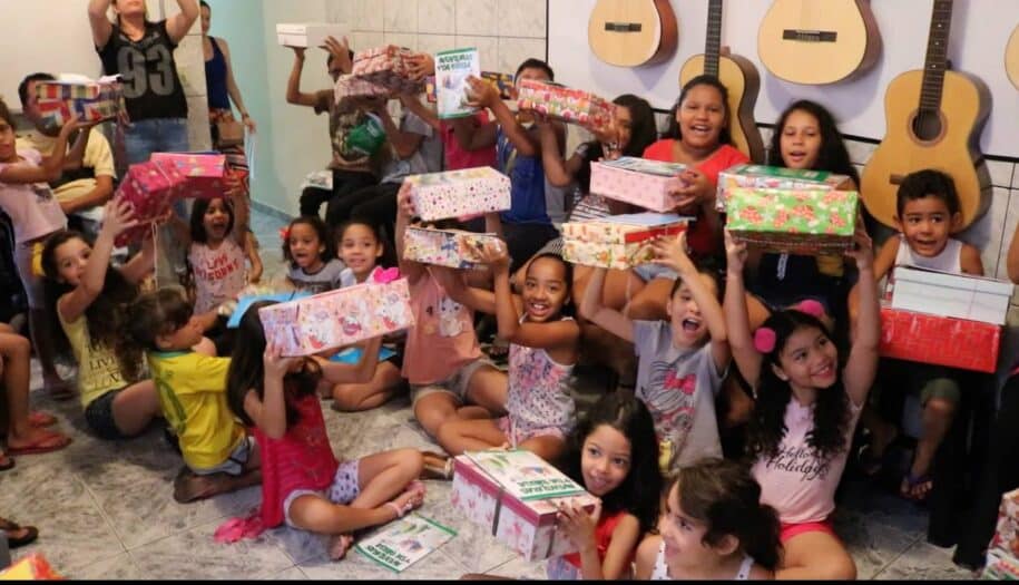 children receive shoe box christmas gifts