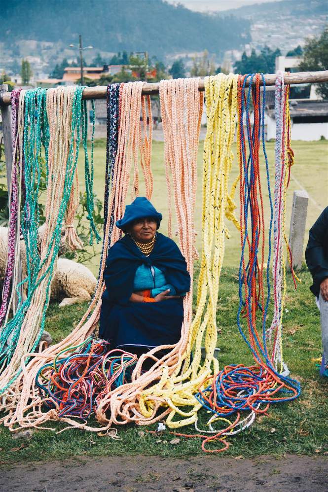 Image of a lady wearing blue clothing at the Animal Market in Otavalo, Ecuador