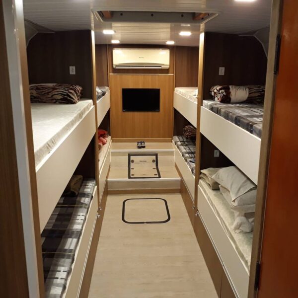 renovated motorhome with beds and TV