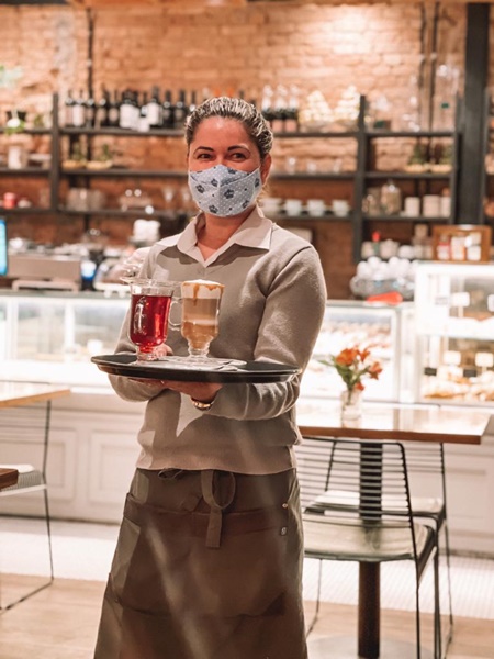 waitress at nica café - bakeries/cafes in the gardens