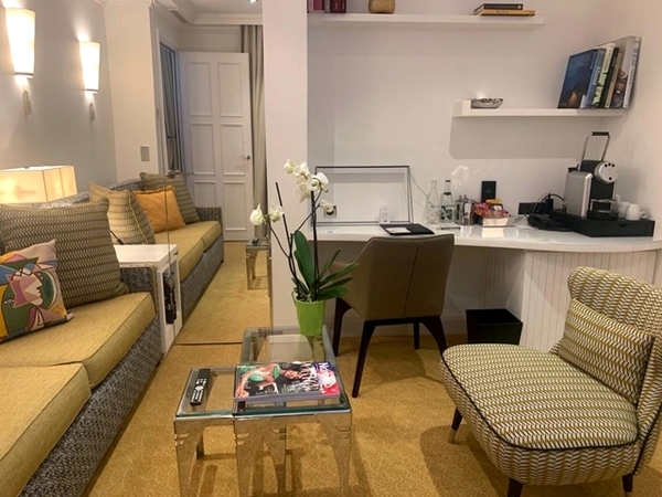 living room of one of the suites, with sofa, coffee table, chair