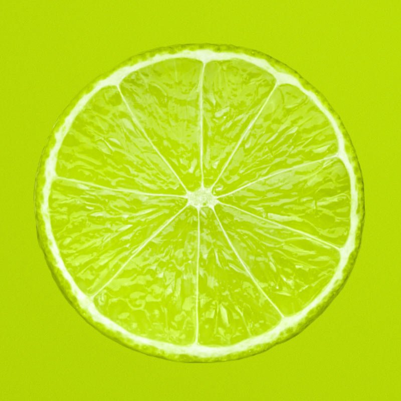 Lemon slice on a green background.