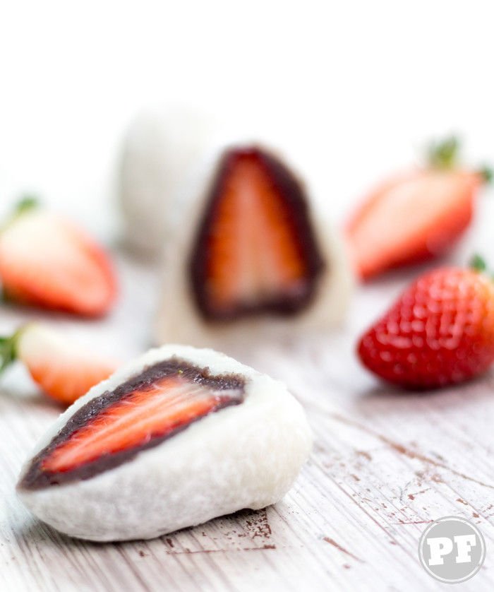 Featured Strawberries and halved mochi on a white table