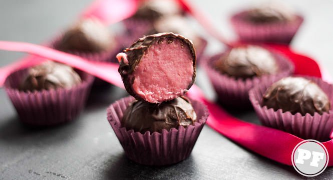 Champagne truffles cut in half showing the pink interior