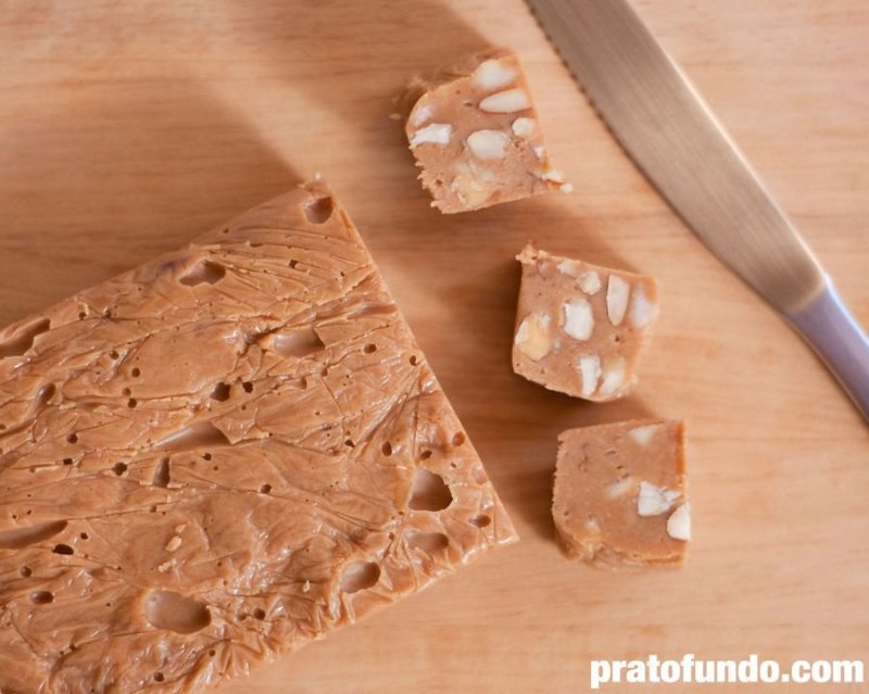 Caramelized White Chocolate Fudge cut into squares on a wooden board seen from above