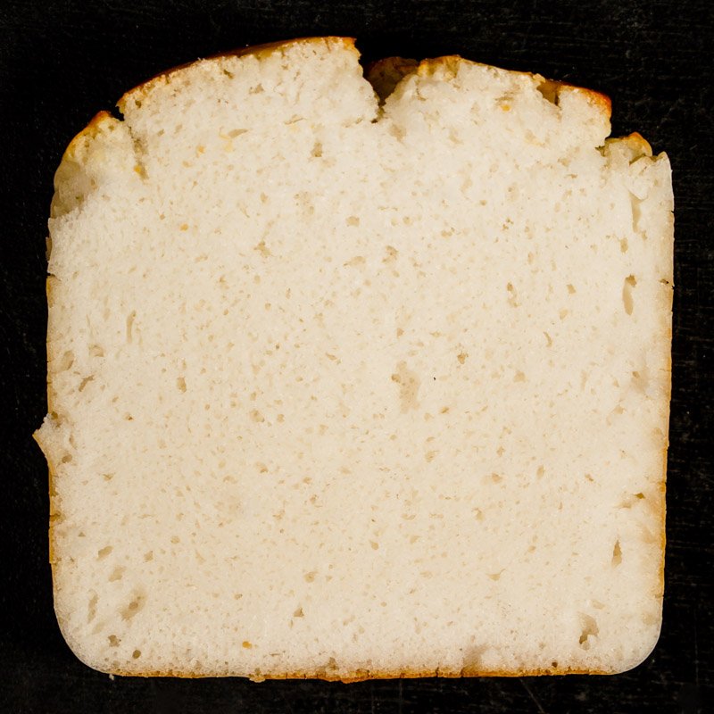 Slice of rice bread showing uniform crumb.