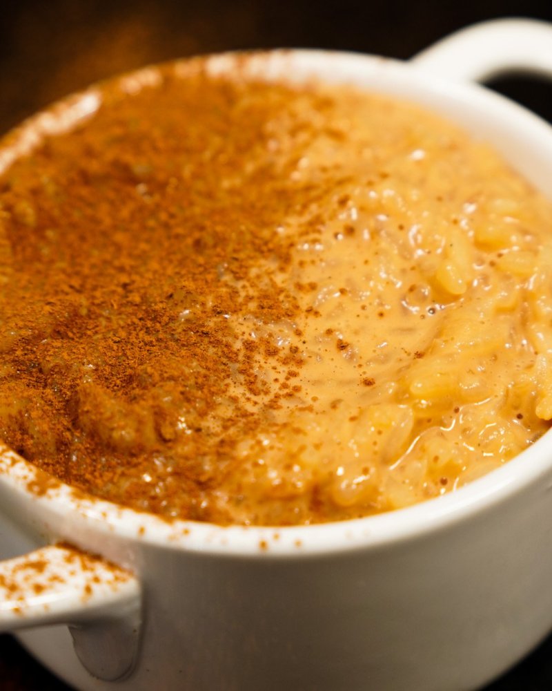 Dulce de leche rice pudding with cinnamon powder.