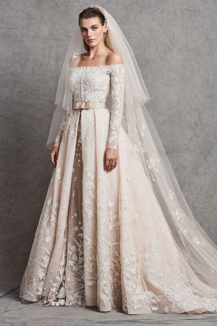 Off-the-shoulder wedding dress with voluminous skirt