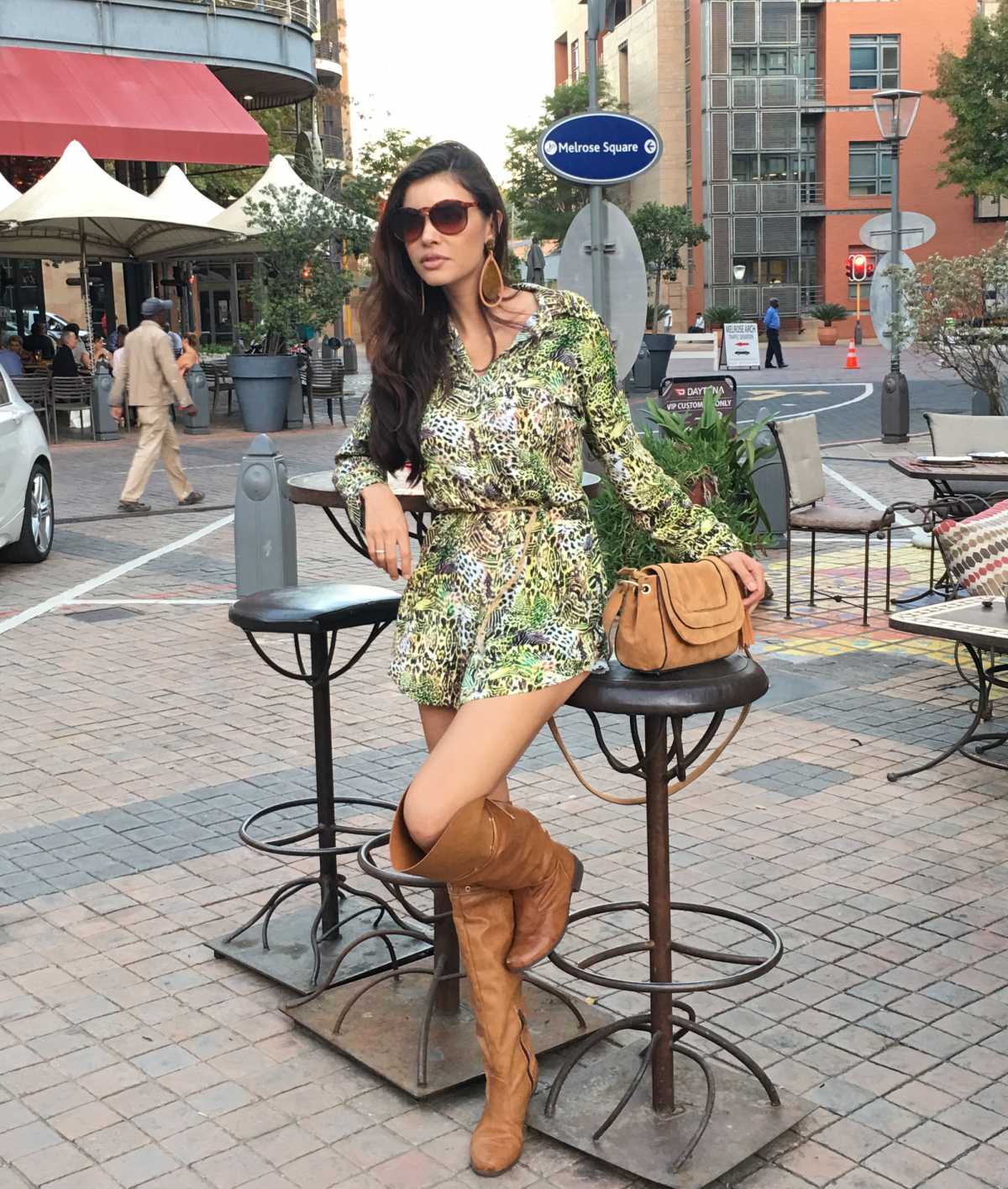 green dress with flowers and long ankle boots