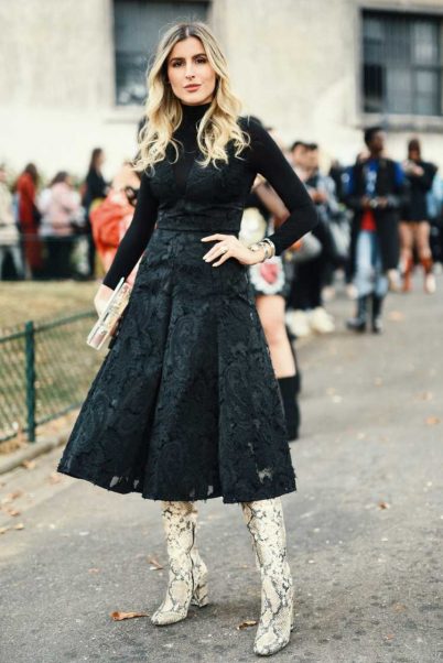 Country boots in a look with a black dress  