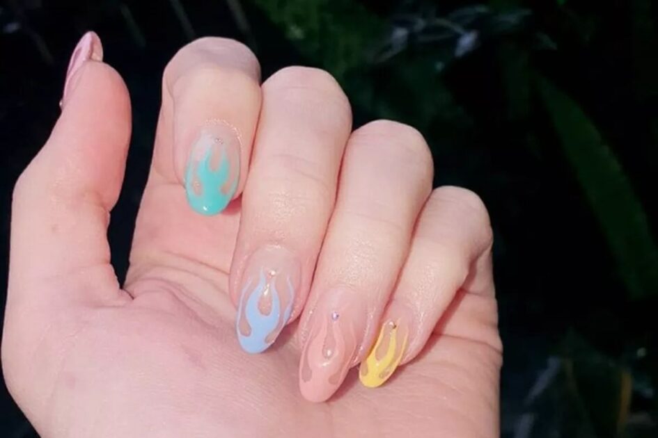 rainbow colors in pastel tones - Nail decoration trend 2024