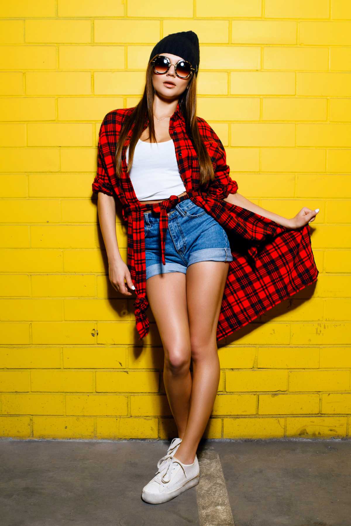 look with denim shorts and plaid coat