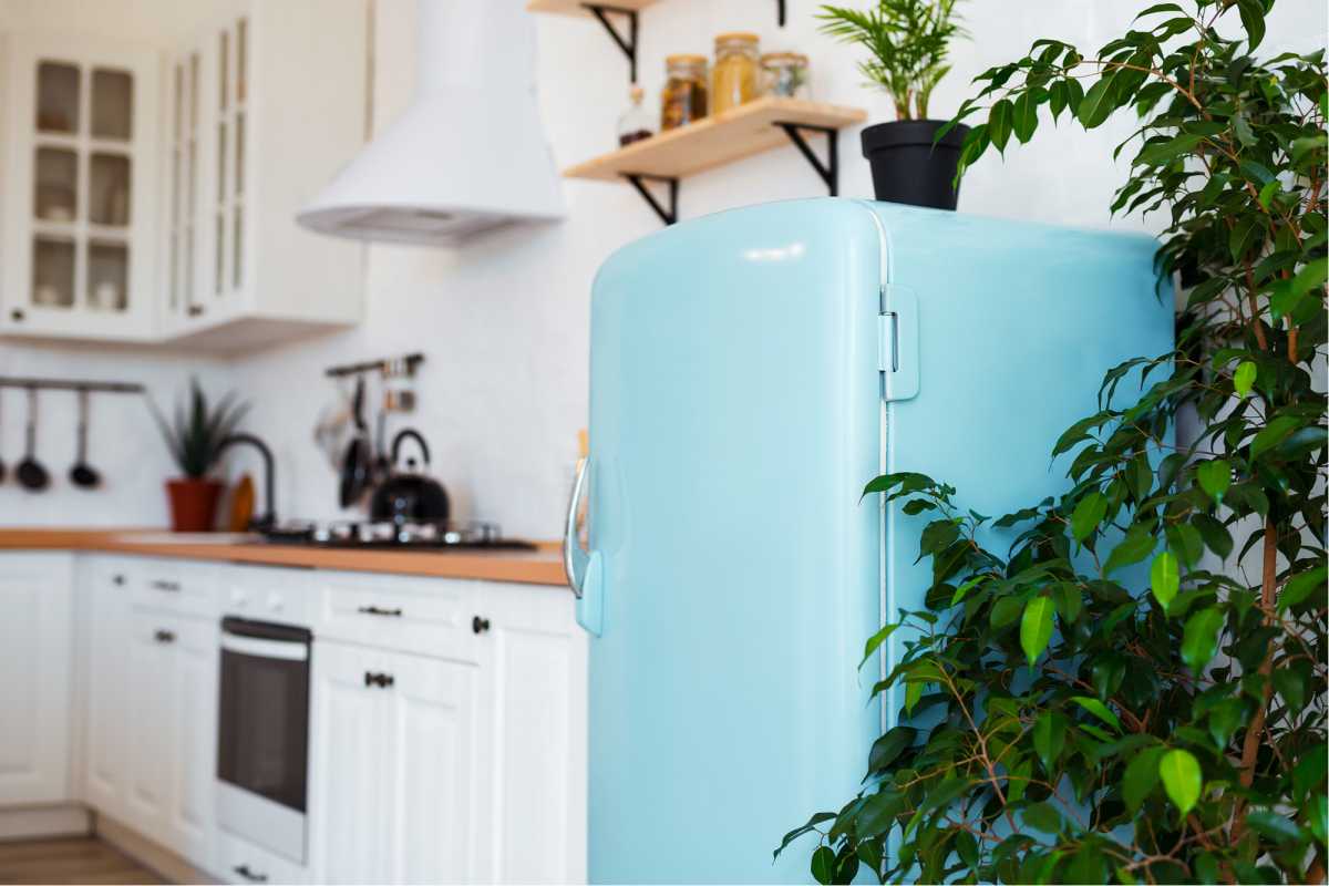 Kitchen with blue retro style refrigerator