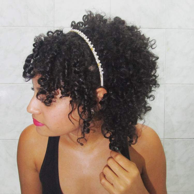 hairstyle for curly and short hair with a bow behind the ear