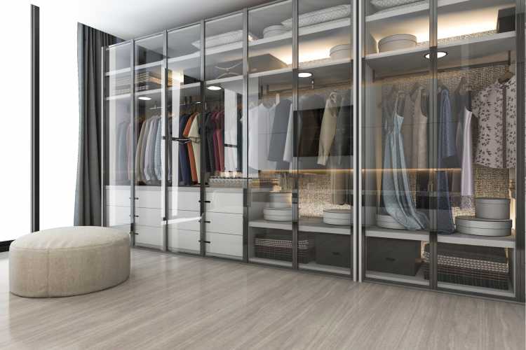 modern closet with glass cabinet doors