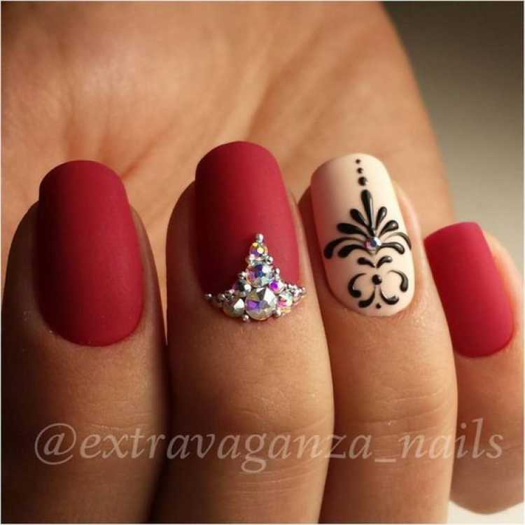 Nails decorated with matte red nail polish