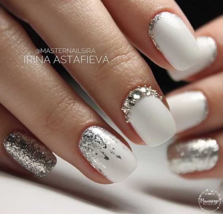 Nails decorated with white nail polish