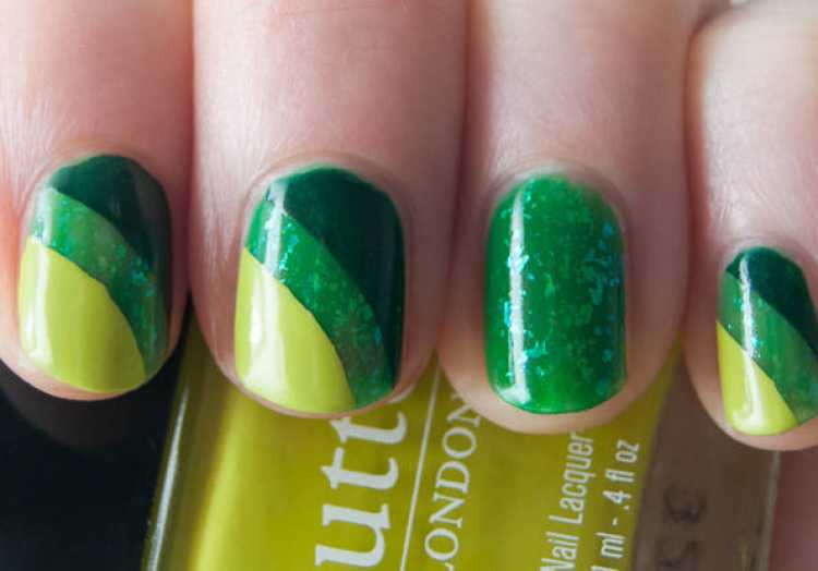 Nails decorated in green and yellow to support Brazil in the World Cup