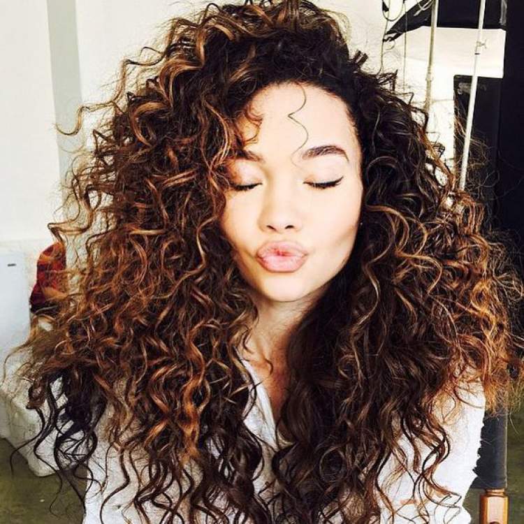 Lightened brown curly hair