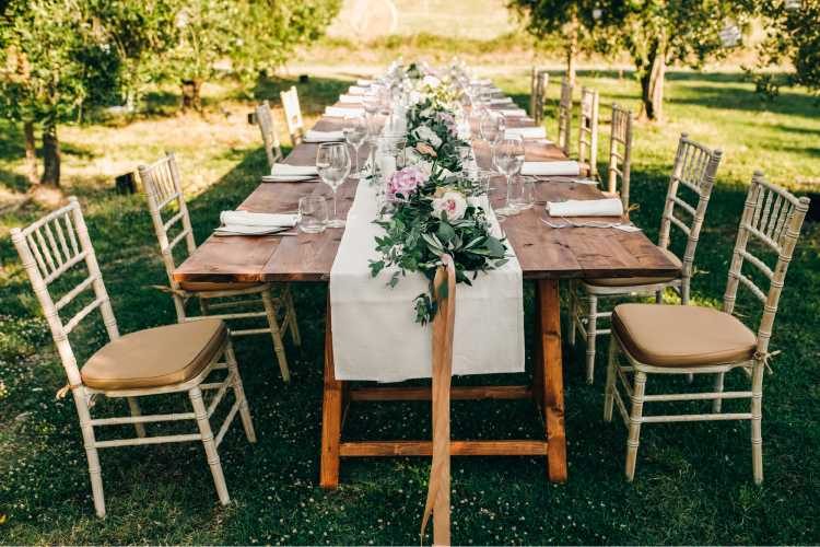 tables decorated for wedding on the grass