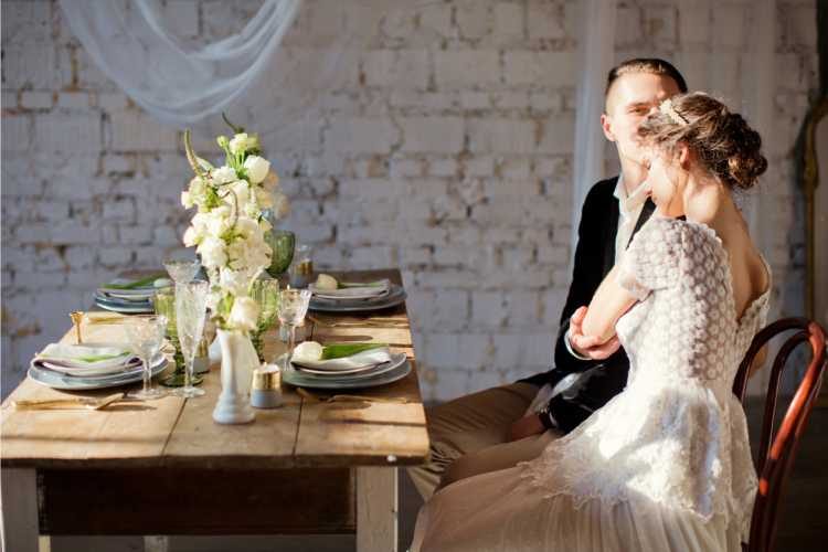 Bride and groom sitting at the table