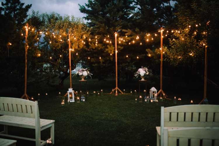 Wedding ceremony altar decorated with simple lamps