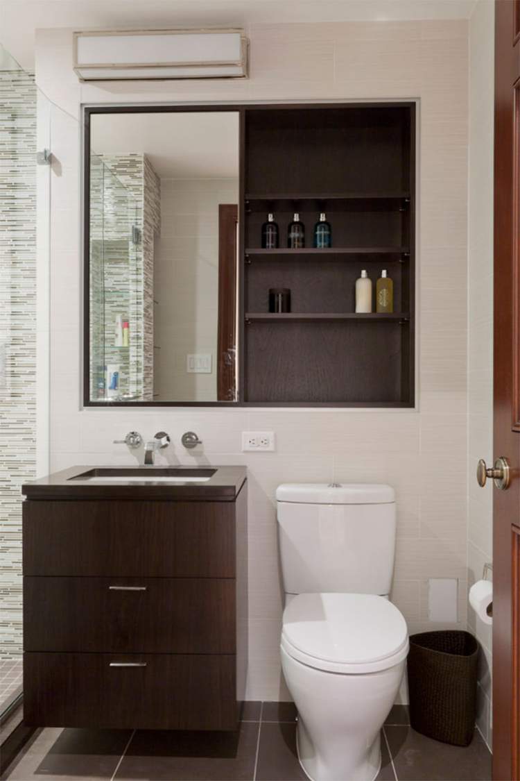 Cabinet built into the wall to make a small bathroom more spacious