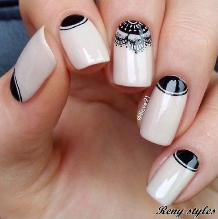 Nails decorated with black half moon