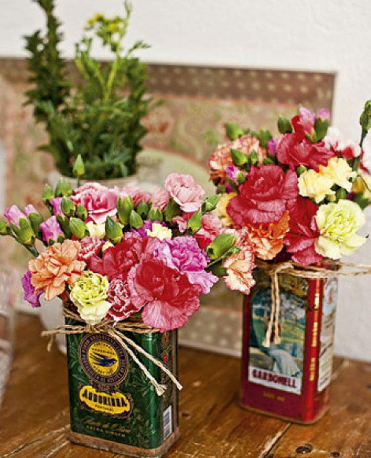 Flower pots in olive oil cans