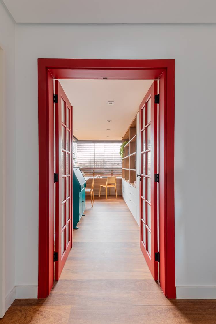 Red glass door and two open partitions lead to the office.