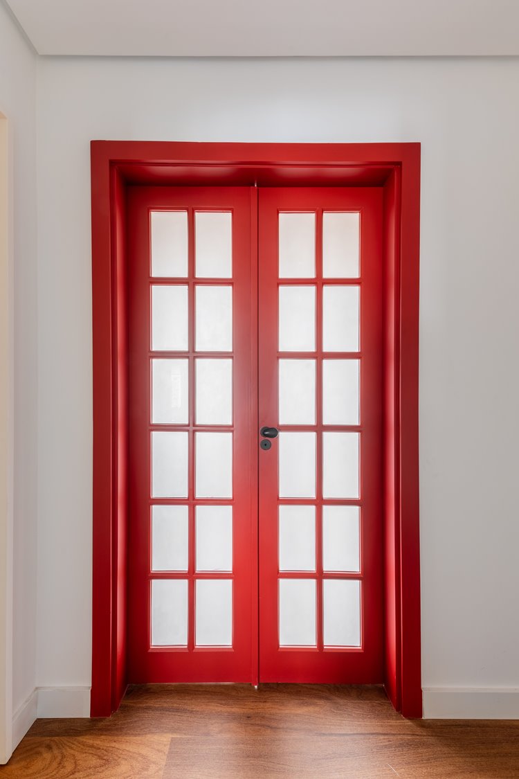 Red glass door and two compartments closed on a white wall.