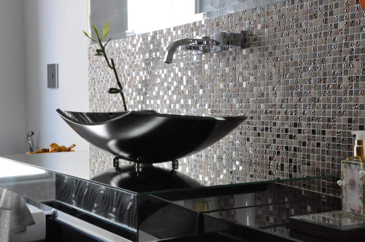 bathroom with dark colors on the wall