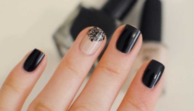 Dark nail polish with metallic ribbon to decorate your nails