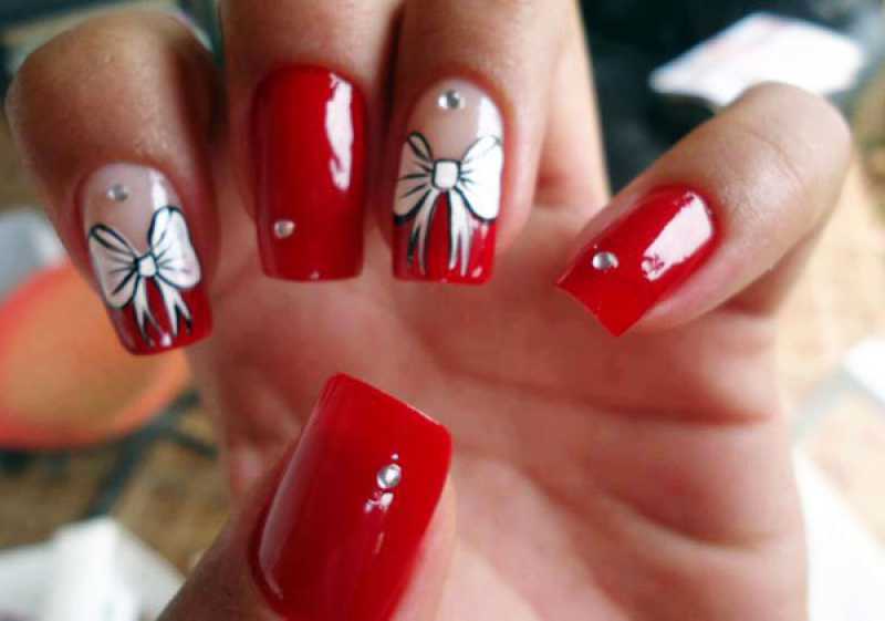 Nails decorated for work with red nail polish