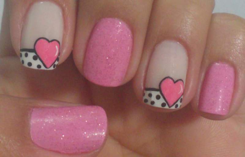 photo of nails decorated with hearts