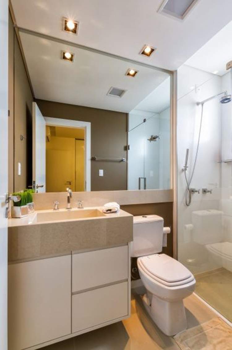 small bathroom with large mirror