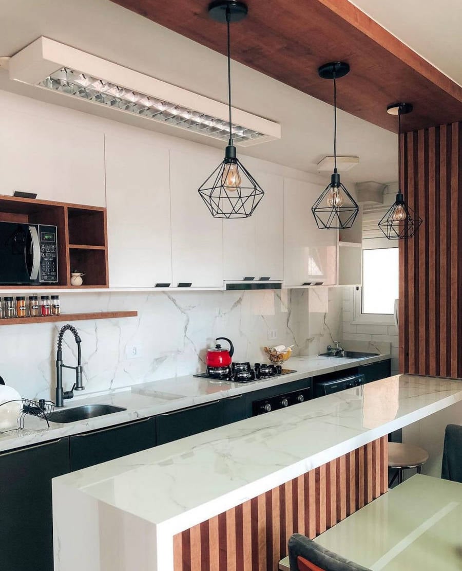 Simple American kitchen with black and white cabinets.