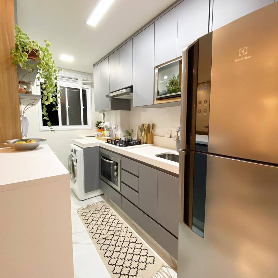 Small American kitchen with gray cabinets.