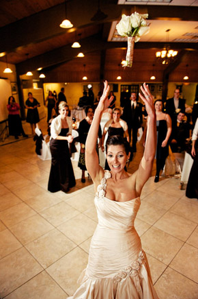 bride throwing bouquet