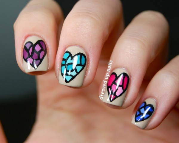 Nails decorated with colorful hearts