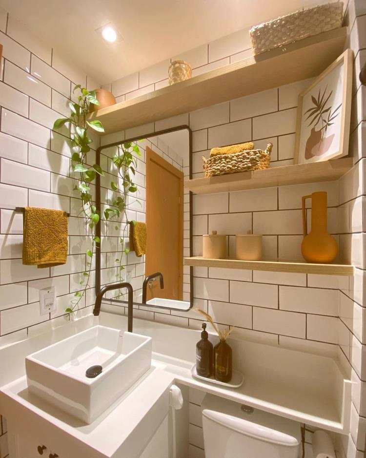 white bathroom with black grout and white furniture