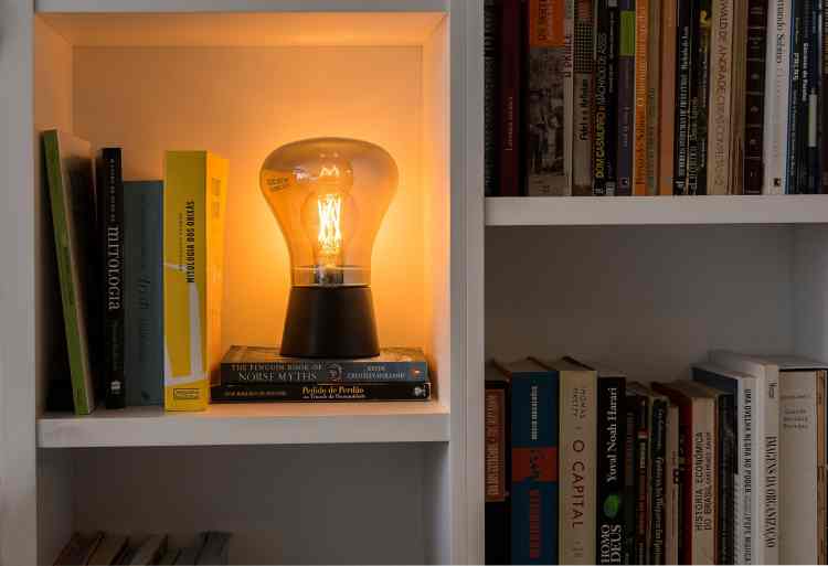 bookshelf niche decorated with yellow lamp