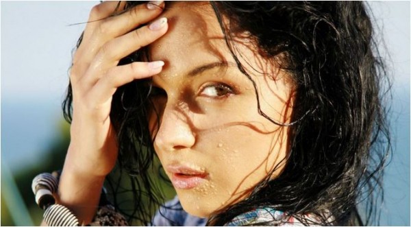 Woman untangling her hair with her hands