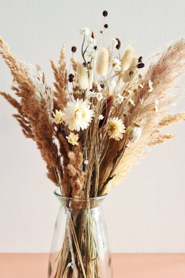 Vase of dried plants.