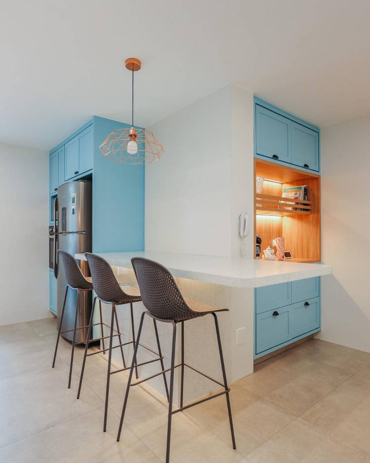 Kitchen with blue furniture.