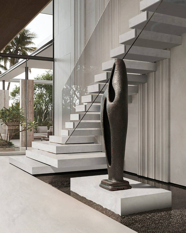 Stairwell with large black sculpture.