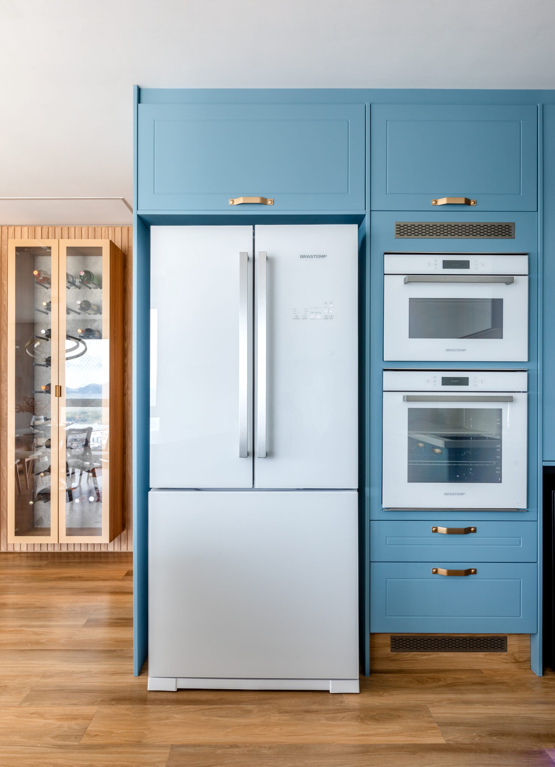 Blue kitchen with custom cabinetry.