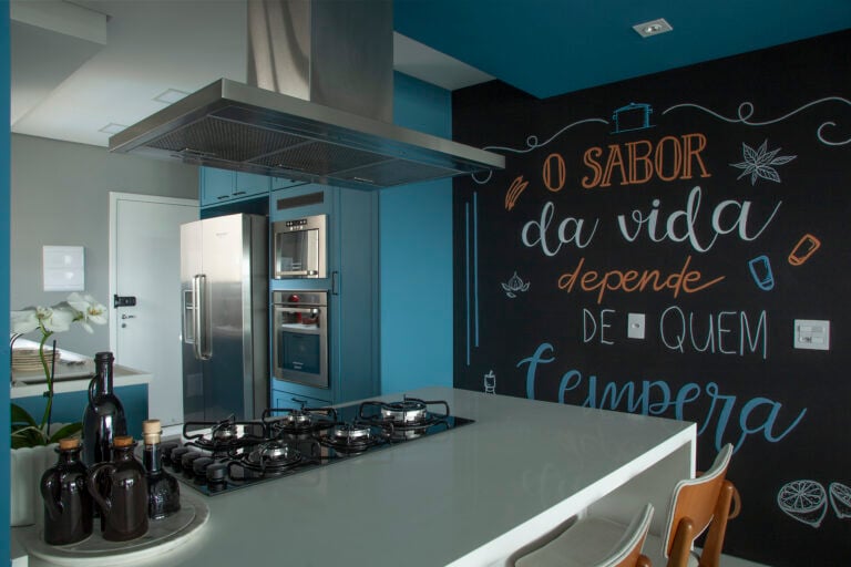 Blue kitchen with chalkboard wall.